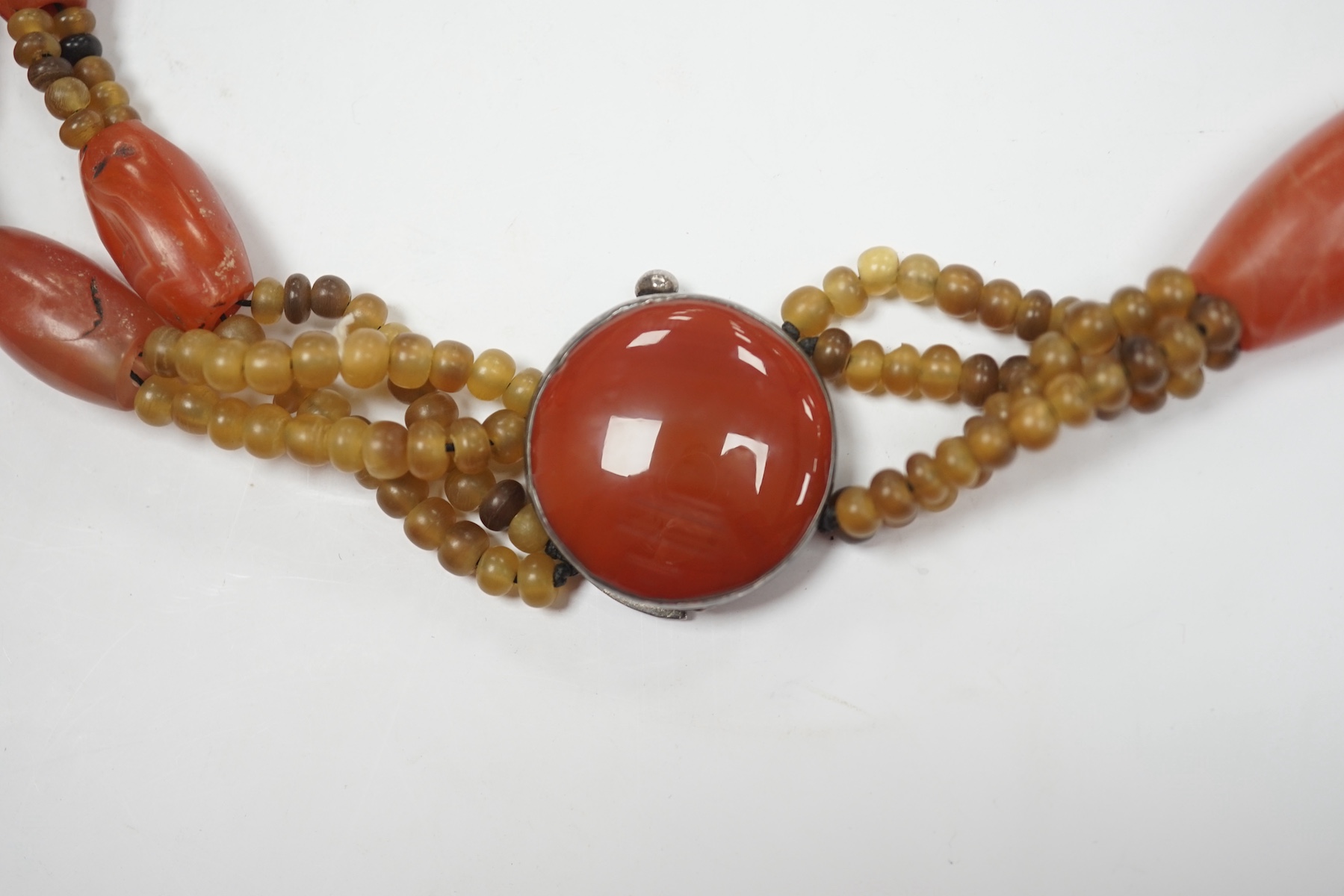 A mid 20th century Chinese chalcedony necklace, with carved pendant and sterling clasp, overall 54cm. Condition - poor to fair